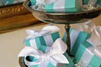 bridal shower favors packed into tiffany blue boxes and with white ribbons will be a nice idea for such a themed party