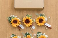 cute wedding boutonnieres of sunflowers with greenery and white blooms are bright touches