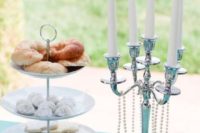 decorate your dessert table with a large candelabra with pearls, black lace and white candles