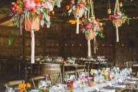 potted flowers and greenery on the table and over it to decorate the wedding reception space in a sustainable way
