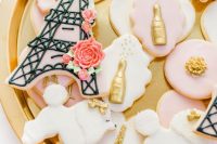 lovely pink and white Parisian bridal shower cookies shaped as pouddle and Eiffel Tower