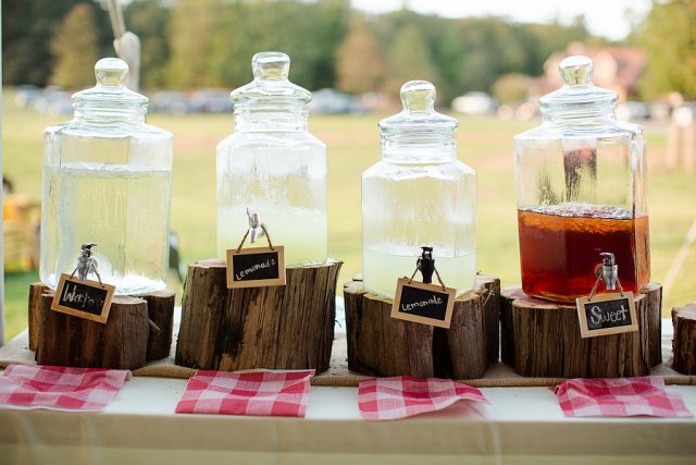 place drink tans on tree stumps and with plaid napkins for a rustic and cozy feel