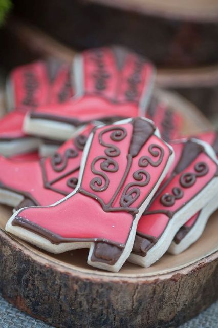 red chocolate covered cowgirl boot shaped cookies as party favors
