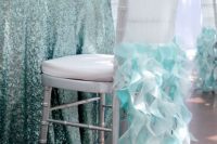 a glam mermaid bridal shower reception with an aqua-colored sequin tablecloth and a neutral chair with blue ruffles, some aqua napkins