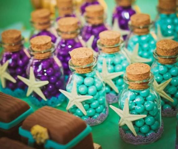 mermaid bridal shower favors or just candies on the dessert table - purple and turquoise ones in bottles, accented with starfish pendants