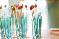 mint blue and mint green glasses with colorful stirrers are great to serve drinks at your mermaid bridal shower