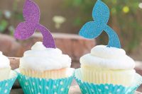 cupcakes with frosting and glitter mermaid tail toppers are amazing for your mermaid bridal shower