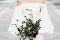 Bridal bouquet with blackberry branches with ripe blackberries