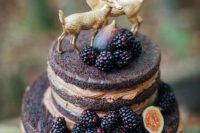 Dark wedding cake decorated with blackberries
