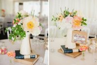 lovely travel-themed wedding centerpieces of metal jugs with pastel and neutral blooms, greenery, book stacks and mini maps are awesome