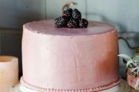 One tiered wedding cake with blackberries