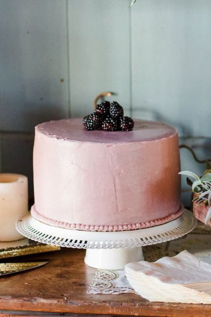 One tiered wedding cake with blackberries