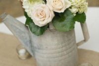 Watering can table number with roses