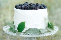 Wedding cake with blackbarries and greenery