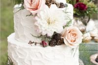 Wedding cake with flowers and blackberries
