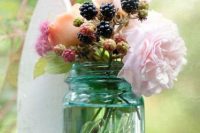 Wedding centerpiece with blackberries and flowers
