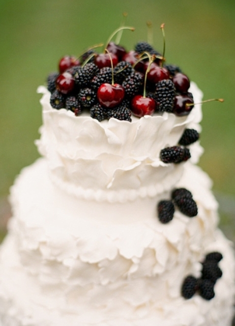 White wedding cake with blackberries
