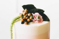 an ombre retro bridal shower cake with berries, pink ranunculus and greenery on top is a great idea for spring or summer