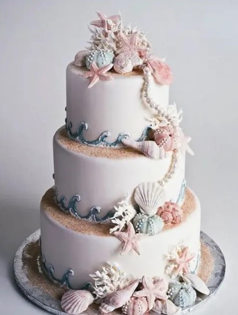 gorgeous seashore cake that looks very natural, with sand, shells and star fish is a fantastic idea for both mermaid wedding and bridal shower
