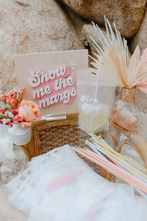 lovely retro-inspired pastel bridal shower decor with a cool sign, blooms and dried fronds is a cool idea to rock
