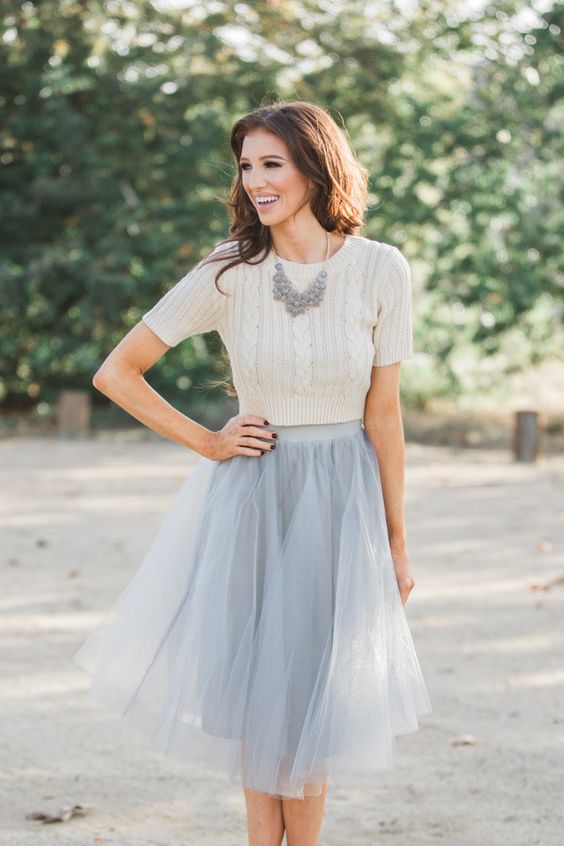 grey midi tulle skirt with a creamy top and a statement necklace