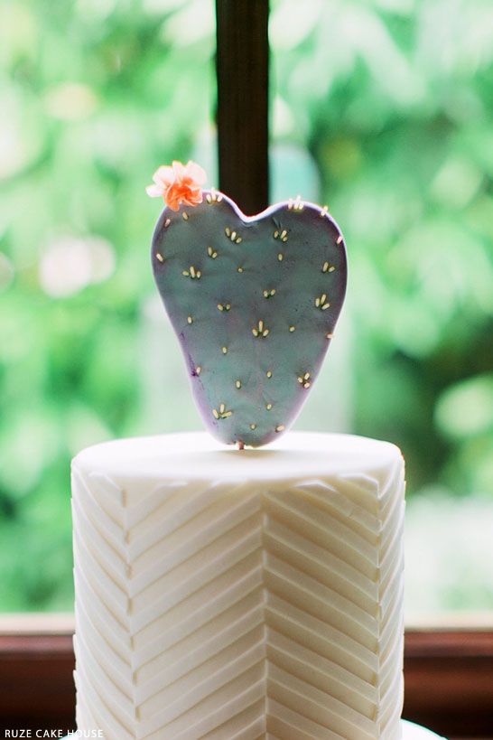 chevron wedding cake with a cactus topper