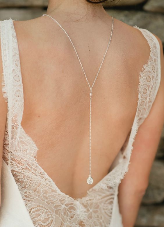 long chain necklace with a crystal charm