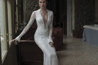 28 long-sleeved lace plunging neckline gown