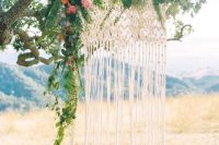Macrame knotted wedding backdrop for outdoor weddings