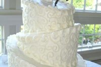 Topsy turvy wedding cake with funny cake topper