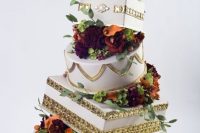 Topsy turvy wedding cake with gold print