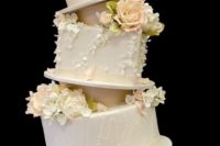 Topsy turvy wedding cake with various tier shapes