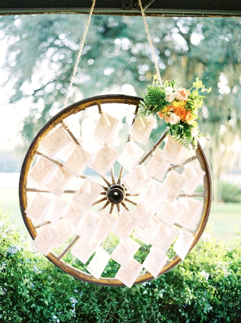 Wagon wheel as a display for escort cards