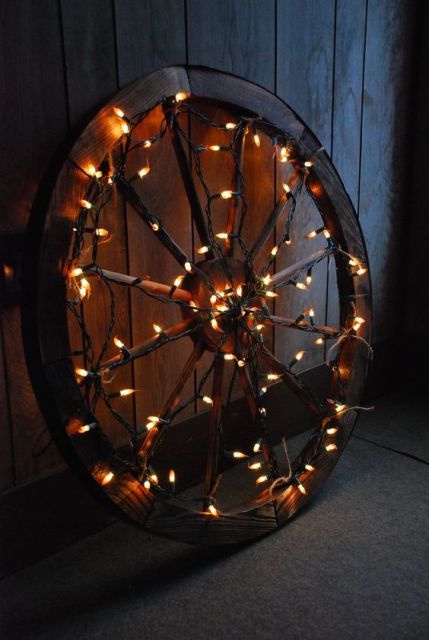 Wedding decor details with wagon wheel and lights