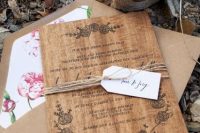 Wood wedding invitation wrapped by twine