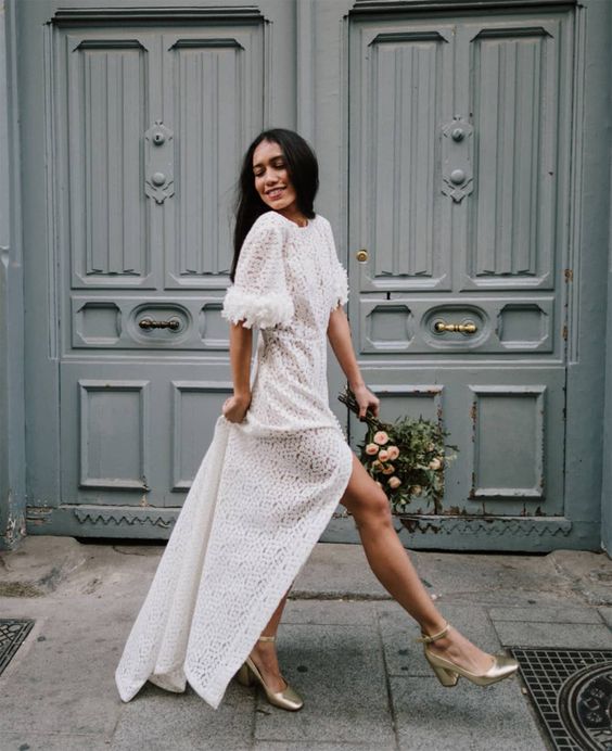 a printed maxi white dress with a high neckline, short fluffy sleeves, metallic shoes are a cool combo for a bridal shoer or a casual wedding