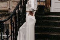 a silk pantsuit with a cropped blazer, wideleg pants, a lace top, a hair tie and statement earrings