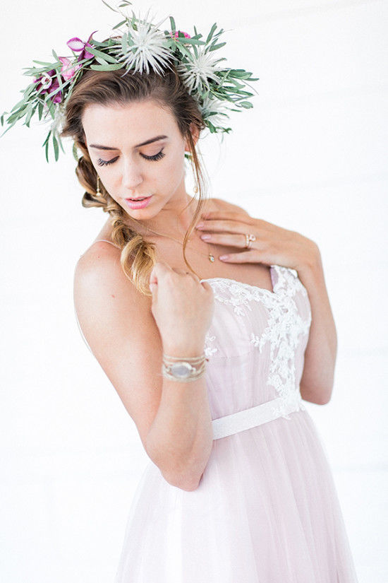 The first bride rocked a romantic pink ruffled gown