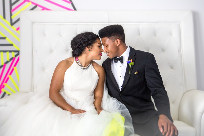 This bold modern couple chose neon for their big day decor and pulled it off brilliantly