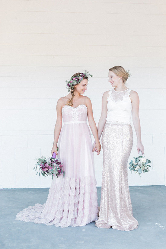 The second bride was wearing an off-white lace appliqué crop top with a fit and flare rose gold sequin skirt