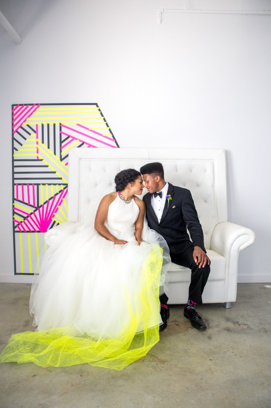 Her white dress was accentuated with neon yellow tulle