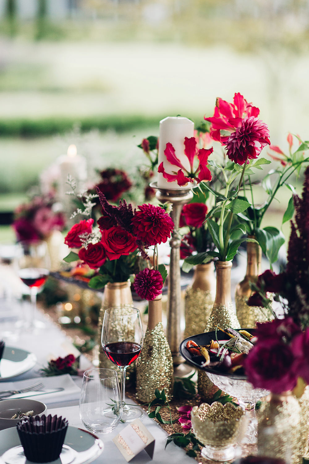 Enjoy the lush gold and red table decor for this shoot