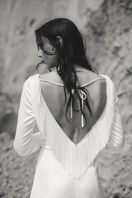 Boho open back dress with a fringe back is cool for a free-spirited bride