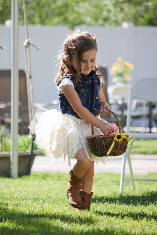 a white tutu dress, a denim vest and boots for a rustic fall wedding