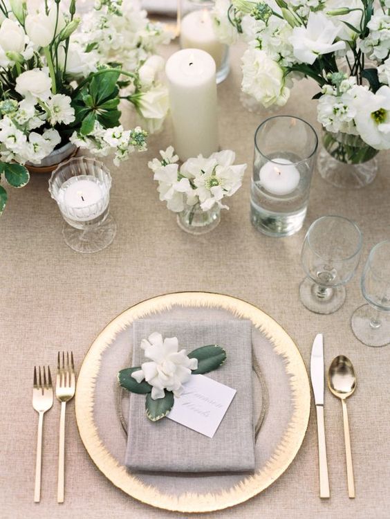 grey, white and gold table setting with white florals