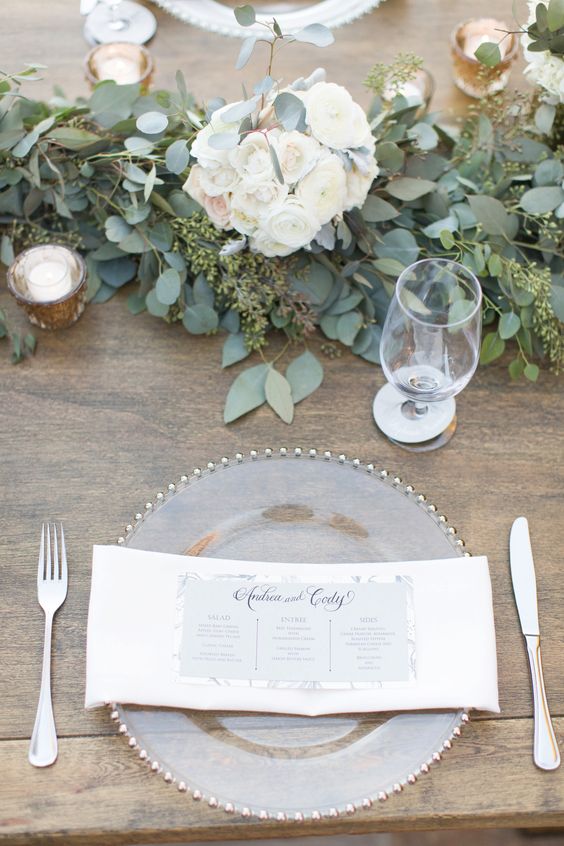 28 white and blush pink florals with eucalyptus leaves, long wooden tables with with greens and flowers for runners