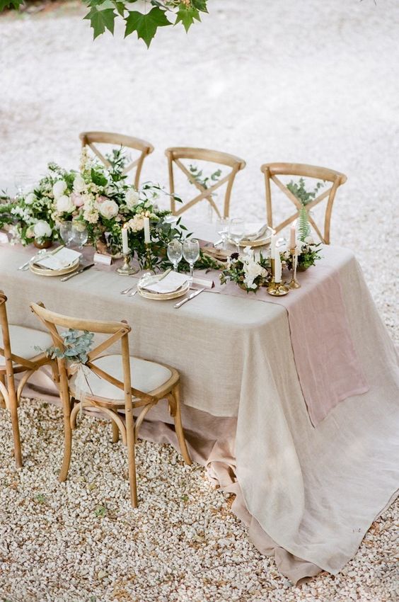 soft neutral table setting with greenery