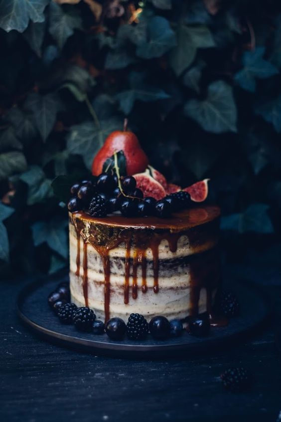 layered dripping wedding cake with fall fruit