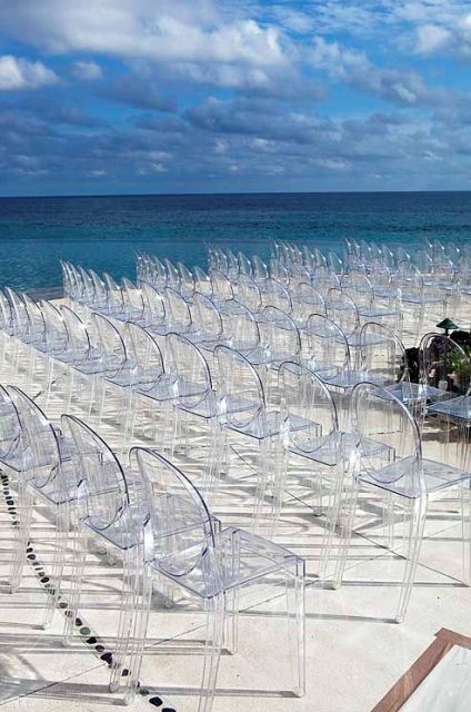 Lucite chairs for beach theme wedding