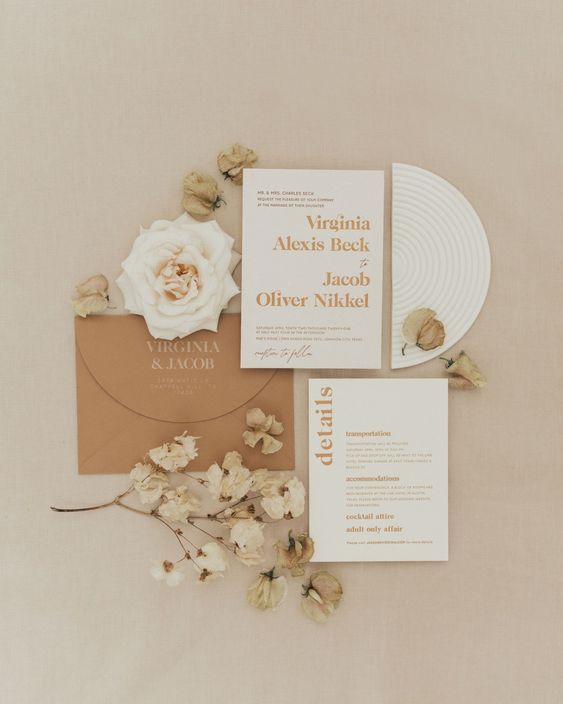 a neutral wedding invitation suite in rust and white is a lovely idea for a neutral boho fall wedding
